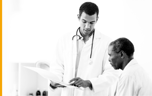 Hypothetical male doctor conversing with patient