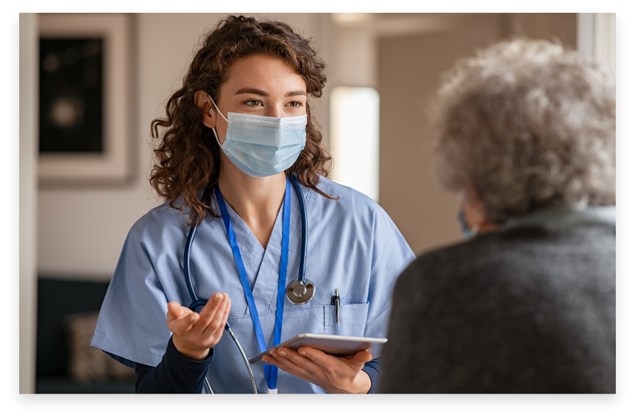 Healthcare provider consulting with an older patient